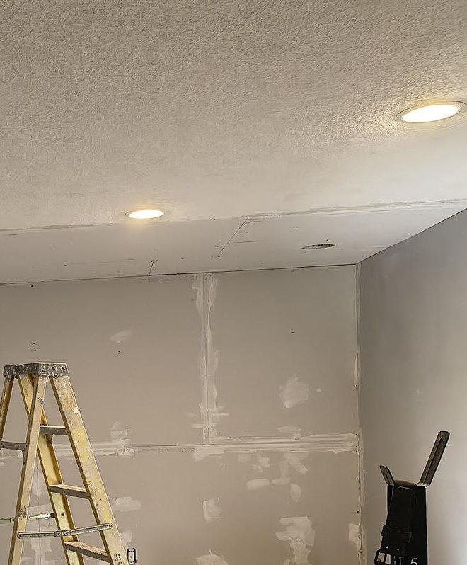 Drywall installation and hanging in progress